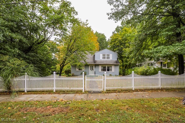 Welcome home to 703 Avondale Street in beautiful Kent, Ohio. With an inviting white picket fence on a quiet tree lined street, this adorable Cape is just waiting for its next owner. Offering four bedrooms, two full baths, and an attached two car garage with nature stone flooring, this well maintained residence sits on a corner lot just blocks from Kent State University. Enter from the garage and you will be greeted by a den and first floor laundry which leads to the kitchen, living room, two bedrooms and first floor full bath. Upstairs holds the additional two bedrooms including the primary with ample closet space/built ins and full bath. Minutes to downtown Kent, shopping & dining, KSU and easy access to major routes, I-76, SR 59 and SR 43. Don't miss out on the opportunity to make this charming home your own. Schedule your private showing today!