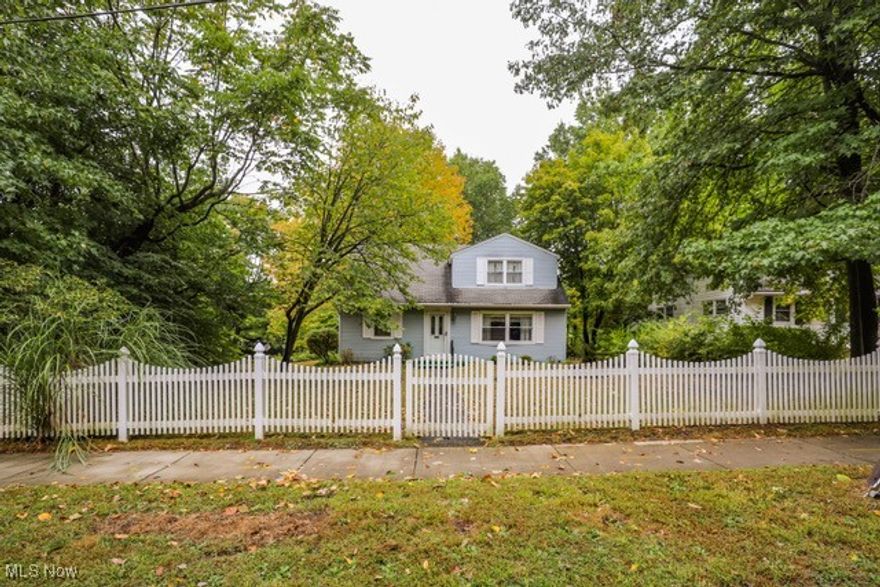 Welcome home to 703 Avondale Street in beautiful Kent, Ohio. With an inviting white picket fence on a quiet tree lined street, this adorable Cape is just waiting for its next owner. Offering four bedrooms, two full baths, and an attached two car garage with nature stone flooring, this well maintained residence sits on a corner lot just blocks from Kent State University. Enter from the garage and you will be greeted by a den and first floor laundry which leads to the kitchen, living room, two bedrooms and first floor full bath. Upstairs holds the additional two bedrooms including the primary with ample closet space/built ins and full bath. Minutes to downtown Kent, shopping & dining, KSU and easy access to major routes, I-76, SR 59 and SR 43. Don't miss out on the opportunity to make this charming home your own. Schedule your private showing today!