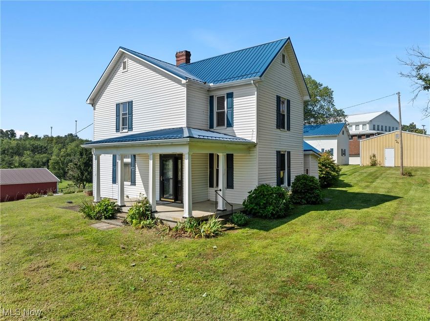 Welcome home to this charming 3-bedroom, 2-bathroom farmhouse nestled on nearly an acre of picturesque land in Belmont, Ohio. Overflowing with traditional farmhouse character, this home features a stunning new blue metal roof (2022) that perfectly complements the matching blue shutters. Step inside to find updated flooring, fresh carpet, and a new furnace—all installed in 2022. The spacious layout includes an additional bonus room that can serve as a 4th bedroom, home office, or rec room. The beautifully remodeled kitchen is a true showstopper, boasting brand-new countertops, cabinets, tile backsplash, and stainless steel appliances. Outside, you’ll find not one but two detached garages—ideal for storage, hobbies, or workshop space. Just a short walk to the village playground, this move-in ready farmhouse is ready for your family to make it home.