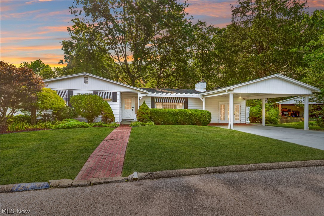 A new price deserves another look! If you have heard it once, you have heard it a dozen times. Location, Location, Location. Want to live near the golf course? How about schools, shopping, and restaurants? Yet, you still want to feel tucked away in a picture-perfect neighborhood. This charming ranch home has you covered. The neutral interior makes it easy to add your own individualized touch, and the spacious layout can accommodate your growing family. The main floor features 4 bedrooms, 2 baths, updated kitchen, hardwoods, 2 fireplaces, large dining room, living room, and an oversized family room. The lower level has a huge recreational room complete with a billiard table and another fireplace. Would you rather be outdoors? Whether you choose to relax on the screened porch or the attached open patio, you will find this private backyard setting a peaceful retreat. The possibilities on this one are endless. Call today for your personal tour of this wonderful property. House has been vi