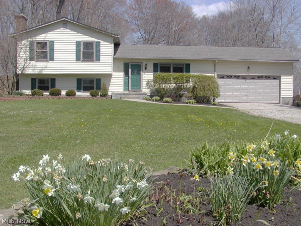 Lot: 97.X 573. Wow What a great 4 level split on over one acre in the city. 3 possible 4 bedrooms. Vaulted ceiling in huge sunken living/family room with fireplace insert and French doors to the spacious yard, deck & private fenced lot. Family room in lower level with second fireplace. Large applianced kitchen with maple cabinets. Jacuzzi tub in lower bath. 24 X 32 2nd garage with 12 foot ceiling plus attached two car garage. 31 X 31 barn with loft. Office off the foyer & eating area. Backs up to Fox Den Golf Course. America's Preferred Home Warranty included.Special assessment is $61 per year for sewer maintenance, continuous.