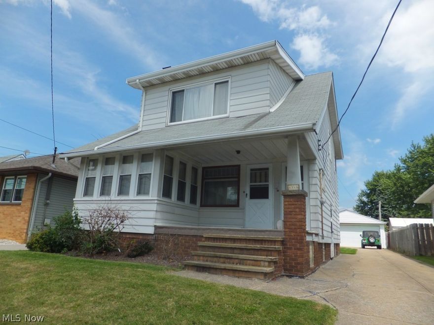 Aluminum sided colonial,eat-in kitchen,formal dining room w/window seat and cabinets,updated 100amp electric box,glass block windows,newer 2 1/2 car garage