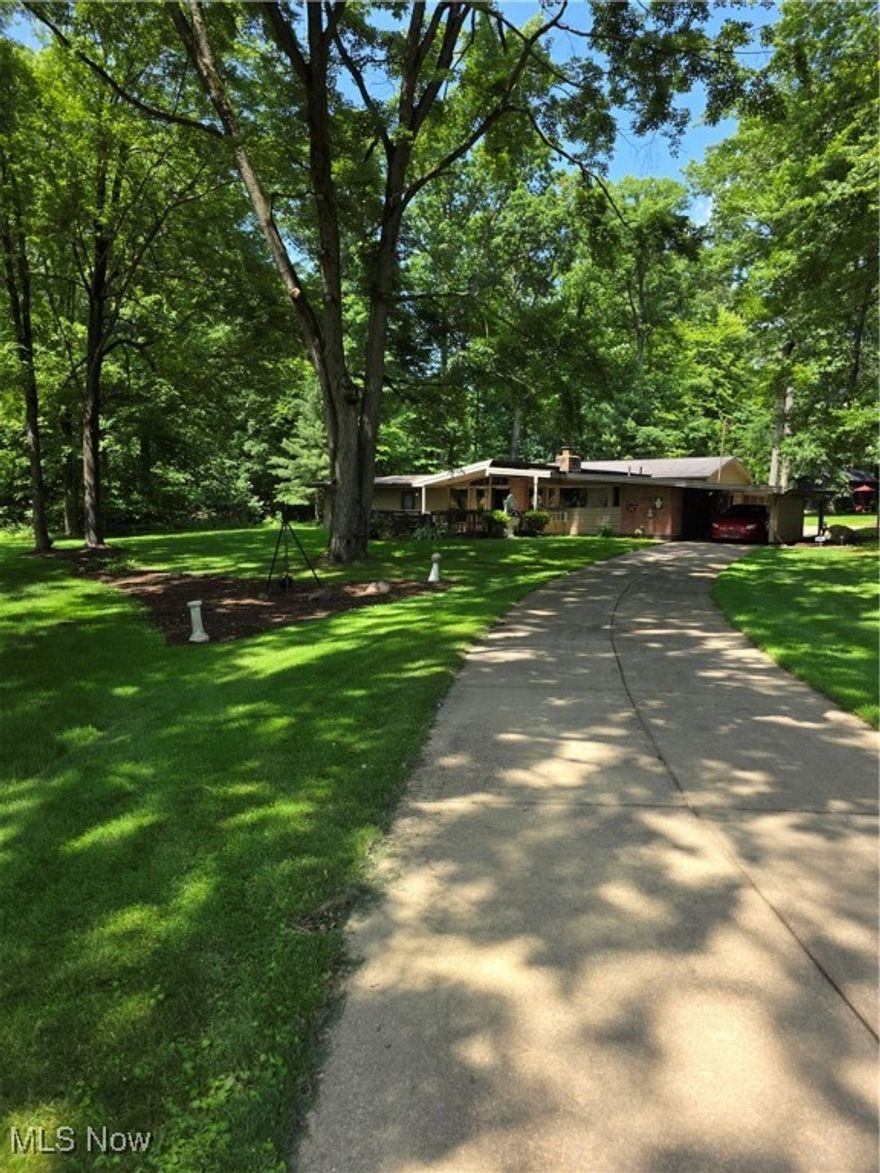 This home is one of 4 built by David Kerr who studied with Frank Lloyd Wright. Something to see. The use of brick, wood and other materials show custom work. Large walk-in closet in master. Built-ins everywhere, tons of closet space. Living room has Tectum Ceilings. (Acoustic wood panels) vaulted ceilings.  Third bedroom could be used as an in-law suite. 4 car detached garage w/gas.  All season sunroom has lots of room. Lot is on a "U" shaped road. This home sits on back of the "U". Nothing but trees an quiet. An occasional deer show up.  Lots of new and almost new features.  Little peace of paradise. Located close to everything.