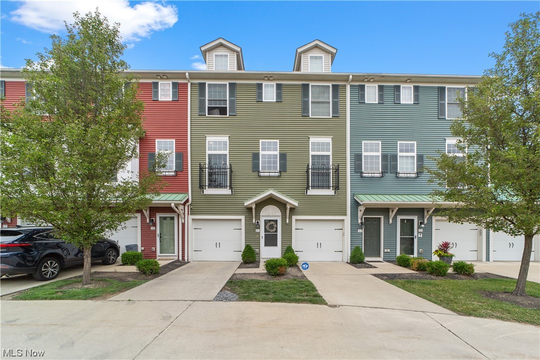 Welcome to your dream townhome in the heart of Rocky River! Nestled in quiet Grandview development, this stunning property offers an idyllic setting with breathtaking wooded views right from your backyard. Boasting 3 bedrooms, 3.5 bathrooms, and a 1-car garage, this home is designed to provide both comfort and convenience. The main living level showcases beautiful wood floors, open concept floorplan and soaring ceilings that allows light to pour in. The stunning eat in kitchen boasts granite counters, ample cabinet space, and center island. Pantry, desk area and powder room allow some separation to the light and bright living room with sliders to the rear deck with wooded views that provides the perfect backdrop. The primary bedroom and the third bedroom on the upper level both feature vaulted ceilings, adding a touch of elegance to the space, and each have ensuite bathrooms as well. The primary bedroom is complete with a large walk-in closet. No more lugging laundry up and down stairs
