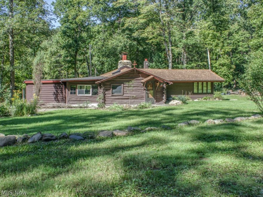 2 bedroom log cabin on 7.24 acres. Detached 2 car garage with 13 x 18 room. 24 x 30 pole barn.