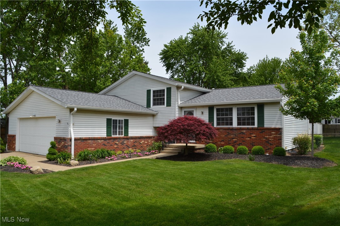 Well-maintained 4-bedroom split-level home tucked away on a quiet cul-de-sac! This inviting residence offers 1.5 baths and a bright, open floor plan featuring a spacious living room, dining area, and kitchen. Sliding glass doors off the dining room lead to a private patio with white vinyl fencing and a fully fenced backyard ideal for relaxing or entertaining. Upstairs, you'll find three bedrooms and a full bath. The lower level includes a fourth bedroom, a second full bath, and a cozy family room with a woodburning fireplace. There's also a full unfinished basement providing plenty of storage or future living space. Conveniently located near shopping, dining, and entertainment. Don't miss this fantastic opportunity to schedule your showing today! Square footage, room sizes and taxes are approximate. Not guaranteed.
