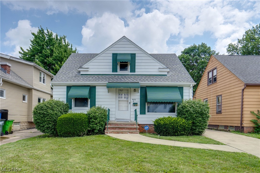 Opportunity Awaits! Bring your ideas to life in this cozy cape-cod conveniently located near all things Garfield Heights! The first floor has hardwood floors throughout and is comprised of a living room, eat-in kitchen, two bedrooms, and a full bathroom. Upstairs find a third bedroom with ample space and a half bathroom. The full basement is partially finished and has potential to be additional living space. Updates over time include vinyl windows and central AC. Recent updates include exterior paint and second floor toilet. Home is Garfield Heights point of sale compliant.