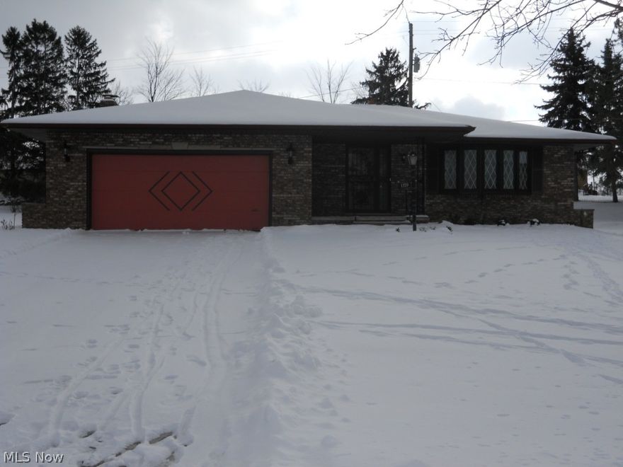 Sharp brick ranch with a great location!  This home is located on a quiet cul-de-sac street and in the heart of shopping, restaurants and easy freeway access and more! The home features a spacious eat-kitchen with refrigerator, range, dishwasher, lots of cabinets and counter top space.  Kitchen is open to family room and formal dining room.  The family room features a gas fireplace and sliding glass doors leading to the huge enclosed rear porch.  The rear porch is great for extending your living outdoors! All of the bedrooms are large with two closets. The basement has some finishes, but is not a completely finished space.  The basement features a huge recreation room, bathroom, separate laundry room, and an additional bonus room ready to be finished. Washer, dryer, and newer furnace, and glass block windows are also featured.   The oversized two-car garage might appeal to those with larger vehicles or the need to store items for recreational use. This is a great house to call home!