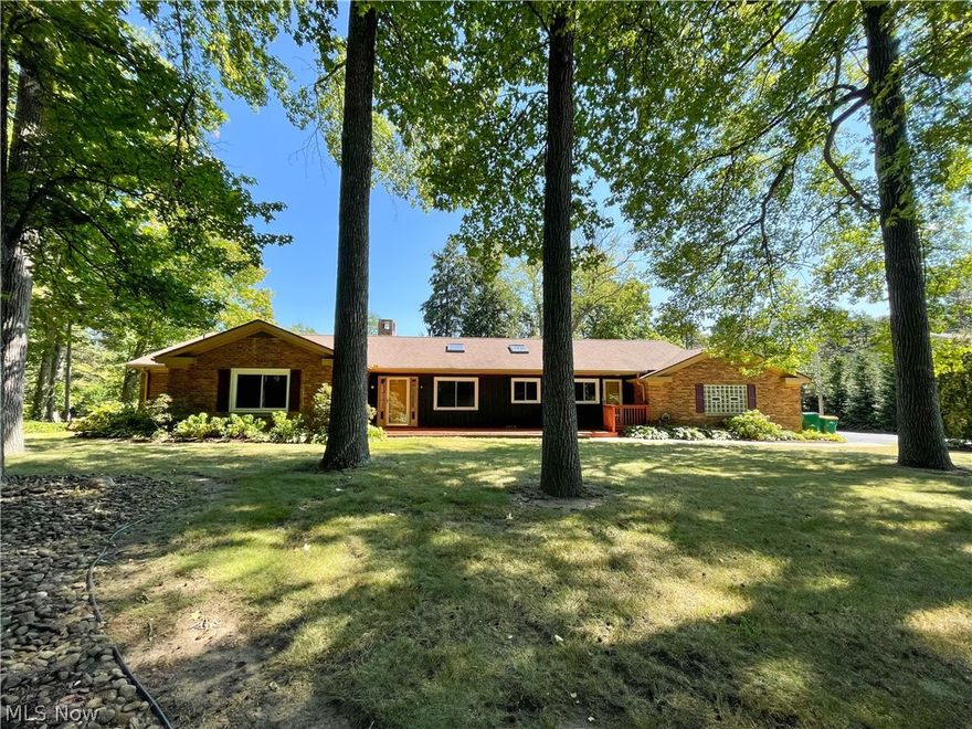 A rare find... what a house, and what a view! This exceptional brick ranch sits on almost 3/4 of an acre and has a private pond nestled in the back that is unseen from the road. Quality construction from the marble foyer to the spacious living room featuring large windows with breathtaking views of the pond. This room has gleaming hardwood flooring and a custom wood mantle on the large wood-burning fireplace with gas logs. Chefs kitchen with vaulted ceiling and skylights. Cherry cabinets, Great counters, and stainless appliances that all stay. This room will accommodate an extra-large table with plenty of room left. The bedroom sizes are amazing. The master has a custom bathroom with a ceramic tiled ceiling and a jacuzzi tub. The main bath also has custom ceramic. It would be hard to find a larger laundry room that spans from the front to the rear of the home, also featuring a full bathroom and includes a washer and dryer with perfect deck access. Garage is 3 car side loading garage wi