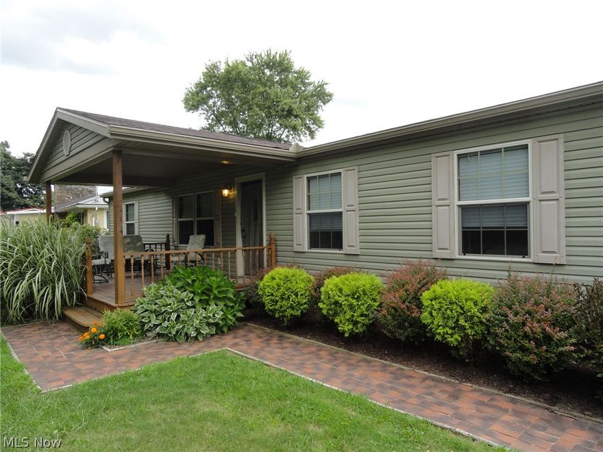 One level living in this open concept 3 BR, 2 Bath home featuring fully equipped kitchen & laundry room with cathedral ceilings in LR/DR/Kitchen combo.  Kitchen features a large center island & office area.  Master suite w/garden tub, separate shower & walk in closet.  Relax on the covered front porch.  Large level partially fenced yard, attached car port w/access to laundry/mud room & kitchen.  Large backyard shed for add'l storage.  Welcoming curb appeal.