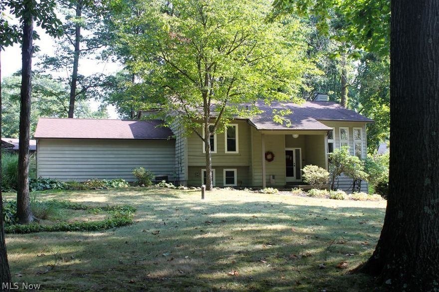 Wonderful 3BR, 2.5 Bath contemporary bi-level with nearly 2,600 square feet is nestled on Oak Hill near east Twin and Dollar Lakes. Open, bright & cheerful with newer paint throughout, it boasts newer furnace, windows, 4 sliders, appliances & wide-plank dark wood flooring. Entertain on the back deck, with access through sliders from both dining & family rooms. Lofted large dining area w/ adjacent 2-story sun-filled Living Room w/ long windows is breathtaking! Owners have loved & improved this property which is set apart on a quiet "loop" street centrally located between Kent & Streetsboro off of Diagonal Road. Find your way easily to points north, south, east & west with quick egress to St. Rts. 43 & 480. Situated in Franklin Township & Kent City Schools. Hop easily to Towner's Woods & the Portage Hike N Bike. It's only a hop-skip  & a jump to The Fairways at Twin Lakes which is now open for public golfing. You’ll appreciate the convenience & low-cost of well water but with public sewe