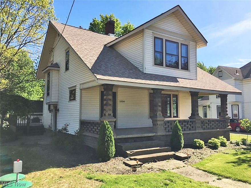 Very clean home with loads of woodwork throughout.  New shingle roof in 2016.  New septic system spring of 2017, nice large covered front porch and 12' x 20' deck off rear kitchen area.  Two car detached garage.  8 acres at rear with temporary greenhouses having second drilled water well.  No zoning.  Wood burner in basement.  Check it out!