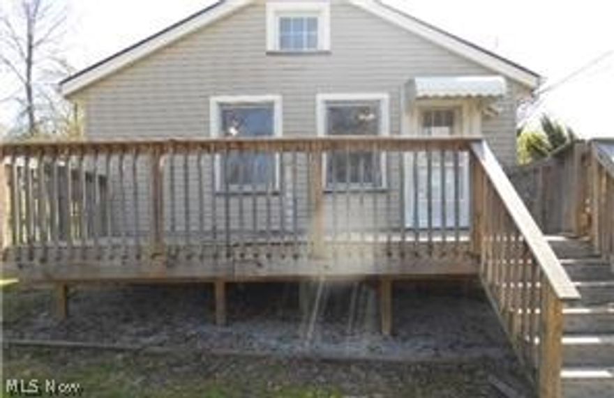 Darling Garfield Bungalow Has Living Room With Beamed Ceiling, Ceiling Fan and Tall Ceiling. Walk Up Attic To Loft/Storage Area. Kitchen Has Dining Area. Large Front & Back Porches For Relaxing! Full, Partially Finished Basement With Glass Block Windows Provides Extra Square Footage! Home Sits On Large .66 Acre Lot With 2 Car Detached Garage. Located Minutes To Freeway Access & Shopping! This Property Is Approved For HomePath Renovation Mortgage Financing.