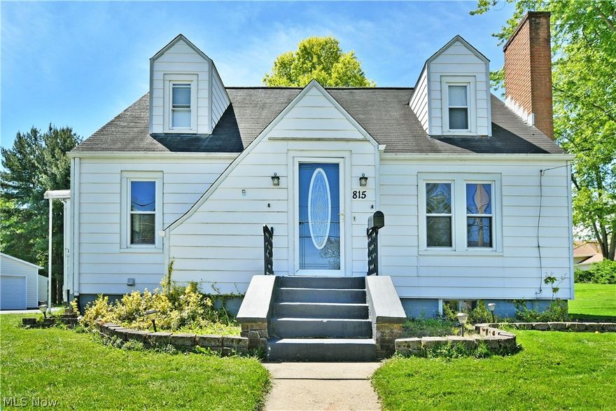 Casual, spacious and full of both natural light and tasteful character, this delightful Salem Cape Cod has all the right moves and more! Located just minutes away from the bustling downtown district, the residence keeps you in close proximity to some of the best hidden treasure restaurants, venues and shopfronts alike. The sizeable lot finds the attractive home sitting elevated from the street with a cement staircase rising from the roadside. The wrapping blacktop driveway continues past the darling sunroom to find both the common rear entry and a large, two car detached garage. Meanwhile, the decorative formal entry opens to find a spacious living room with sunshine spilling across the warm, hardwood flooring, illuminating the stone trimmed fireplace along the far wall. Sculpted entryways continue into the adjacent dining room where elegant hanging lighting creates a welcoming atmosphere. The colorful kitchen provides plenty of downhome, country flare that pairs well with the stainless-steel appliances and contrasting cabinets. Steps away, the relaxing sunroom is sure to be the favorite hangout. Completing the first floor, a sizeable guest bedroom is joined by an engaging full bath. Upstairs, two additional bedrooms include the current master with its built-in shelving. Laundry services are located at the basement level along with a second, oversized full bath.