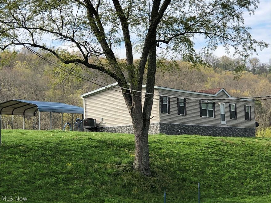 Nice manufactured home. 1600 sqft. city water, septic, yard, garden space. Another older home (mobile with addition on property) can try to salvage or can be removed. Nice country setting 3 bedroom 2 full bath, family room. Sits on 1.5 acres. Call to See today!