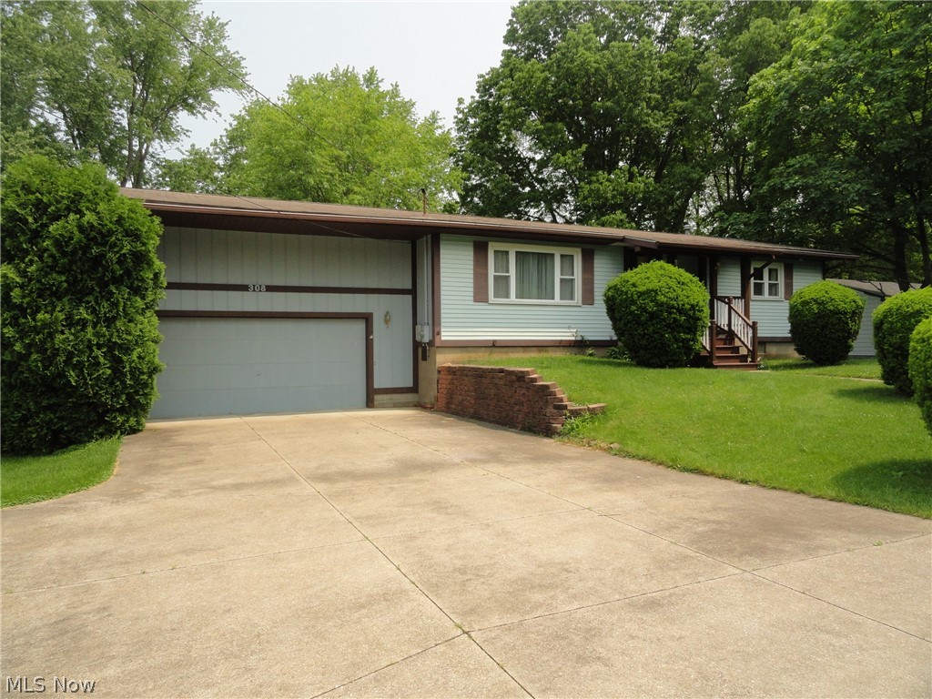 Here's a cozy ranch with some beautiful custom woodwork throughout and natural wood trim too. Spacious, sunny living room. Formal dining that opens to the kitchen plus a French door to a covered deck porch. Newer stainless refrigerator, nice breakfast bar too. Two spacious bedrooms with double closets and ceiling fans,two full baths. Full basement with two large rec rooms plus a laundry/storage area.. The lot is beautiful, just under 1/2 acre, flat and grassy. Nice views of it from the porch and house . Short distance to walk to the middle and high school. New roof in' 08,water heater in '17. Nice home, nice location!