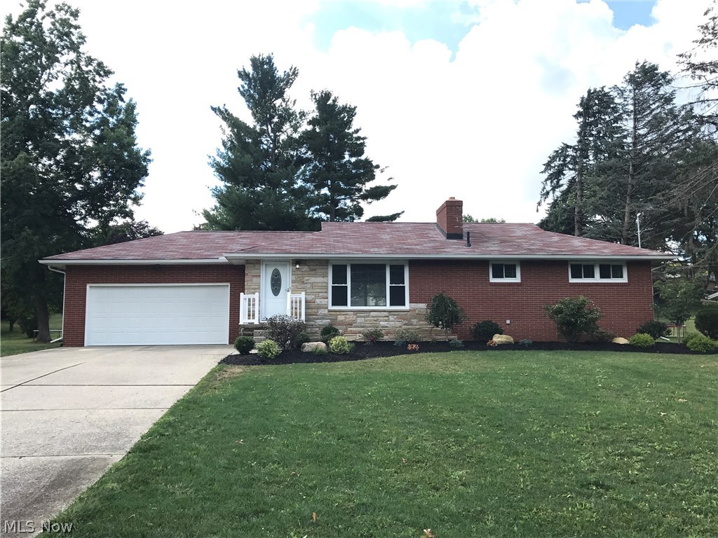 Wow – this brick ranch home shows like new construction and is in a convenient NW Perry location! Completely updated and remodeled 3-bedroom home with nothing to do but move in and enjoy. Solid home with large living room featuring stone fireplace and built-in shelving and everything is new including: flooring, doors, kitchen with granite counters, new cabinets, glass tile back splash and new Samsung stainless steel appliances; high efficient furnace, AC, hot water heater, plumbing, electrical, windows, landscaping and more. Tile floor and custom tile shower surround in bathroom that includes granite top, beautiful new cabinets and whirlpool bath. Fresh paint, new light fixtures, ceiling fans in bedrooms and new windows and doors throughout. Nice private back yard. Large two-car garage with opener and new door. Large, clean, basement with fireplace and glass block windows could be finished off nicely. Steps from Summerdale Park. Do not pass this one up.