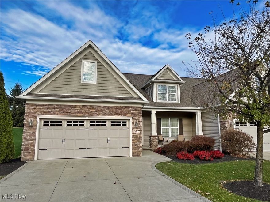 Welcome to The Villas at Taramina, a 55+ community located in the heart of Macedonia. This home was the original model for the community and offers an open, functional layout. The entry foyer is approximately 5’9” wide and leads to a flexible office space. The great room includes a gas fireplace with built-ins, ceiling fan, and engineered wood flooring that extends into the kitchen and dining areas. The kitchen features cherry cabinetry with a warm brown hue, granite countertops, a step-in pantry, and all appliances remain with the home. The primary suite offers a vaulted ceiling, ceiling fan, recently replaced carpet, a large walk-in closet, and a private bath with dual sinks and a linen closet. The mudroom/laundry room is located off the garage and includes a laundry tub, closet, brand new washer & dryer and built-in ironing board. The second floor features two bedrooms, a full bath, loft area, and a 10’ x 22’ walk-in storage room. The basement is unfinished. A stamped concrete patio is located off the sunroom, offering privacy and views of mature pine trees. Construction highlights include 2x6 exterior walls, Pella windows, low-VOC paint, waterproofed block foundation walls, and dimensional shingles. Additional features include an in-ground sprinkler system, central vacuum, surround sound, and a small storage area in the garage. The Villas at Taramina provides a community center that hosts regular gatherings and is available for private events. Convenient access to freeways, the turnpike, shopping, and nearby areas such as Hudson and Aurora. Close to parks, trails, and Cuyahoga Valley National Park.
