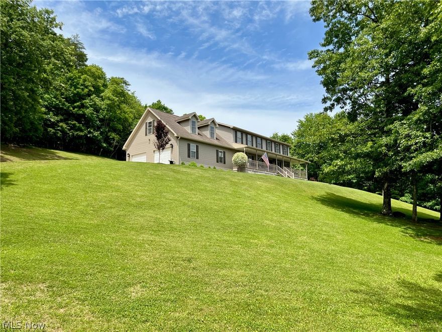 "HOW MAJESTIC AND HOW GRAND!"  Perched on 5 acres of private West Virginia sunbathed glory is this impeccable home full of quality materials, craftsmanship and design detail.  A bonus room could simply become a 4th bedroom, or place for guests, while still offering abundant living spaces.  A sweeping wrap around porch with views for miles and an updated Trex deck across the back outdoor living space invite you to a soak in the hot tub, fun in the side yard or cozy evenings by the firepit.  Updates include; stamped concrete, porch railings, main roof, 2nd floor HVAC, Flooring, water heater, 3 magazine worthy bathrooms and so much more!  The primary suite has double walk in closets and a custom bath with carrara marble, white oak and handmade floor tile.  A poured, dry basement with high ceilings and rough in bath plumbing is yours for re-imagining, if the other nearly 3,000 finished square feet leaves you wanting more.  This one is truly only appreciated in person.  Contact your agent today!