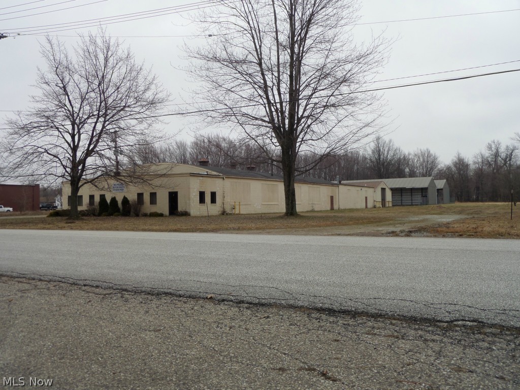 5.9 Acres industrial / commercial space in Madison Village. Former lumber yard has over 15,000 square feet of light industrial / warehouse space + 2 partially covered buildings used for outdoor storage and mini storage units. Currently 1/3 units leased + outdoor storage and mini storage unit rented. With almost 6 acres, there is plenty of room to add on or build additional buildings.