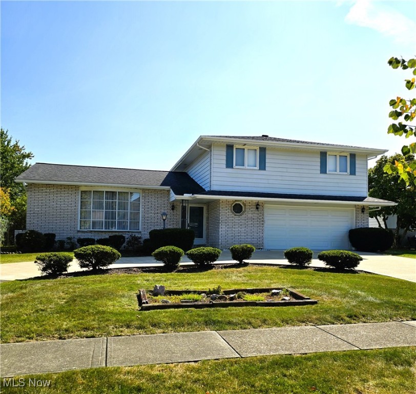 Easy to show! Immediate possession! Longtime owner. Four bedroom, two and a half bathroom Split Level. Big eat-in kitchen with all appliances staying. Formal dining room. Big living room with a bay window! Family room with brick & stone fireplace and slider leading to a patio and nice yard. Owner bedroom has double closets and a full bathroom. Basement has recreation room, laundry room, workshop area and walk-in closet. Horseshow driveway. Loads of storage. Located on a low traffic street. Garage side door 2025, Furnace, central air and hot water tank 2024. Partial driveway 2017. Roof, stove, refrigerator, 2014. Garage door 2013. Includes one year home warranty!