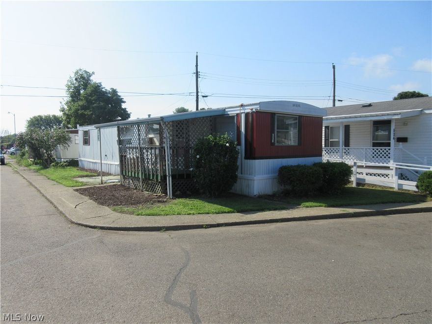 2 bedroom 1 story home.  Covered front porch.  Kitchen appliances included.  Corner lot.  Lot rent $195 per month.  Subject to park approval.  Agent owned.  Utility averages for the last 12 months- gas average $41 monthly and electric average $49 monthly.