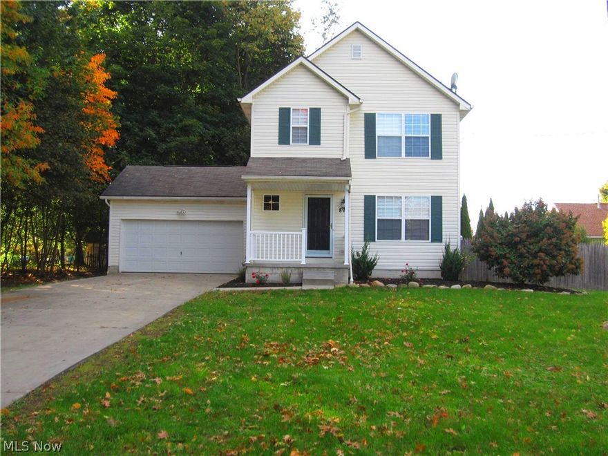 Private setting! This beautiful colonial style home with convenient front porch and extra long driveway features extra wide lot with fully fenced in backyard. One of the great features is a fire pit and the extra space next to this home is wooded, making this a peaceful and inviting setting. You will enjoy this open floor plan with cozy expresso finish kitchen, hardwood flooring, stainless steel appliances (staying), beautiful granite counter tops, and a nice kitchen pantry. Spacious Dining room also features beautiful oak hardwood floors, elegant light fixture and it leads to a beautiful and spacious enclosed deck overlooking peaceful and fully fenced in backyard. 1st floor 1/2 bath also features hardwood floor, expresso finish vanity, granite top and modern sink. Spacious living room invites plenty of natural light, custom wide blinds and window treatments (staying). Wide hallway also has hardwood floors and leads to a 2 car attached garage (with nice shelves for storage). Upper leve