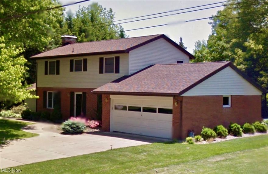 Beautiful 4 bedroom 2.5 bath home in desired Devola.  Property sits on a large flat lot lined with trees for private back yard enjoyment.  Upgraded Kitchen with walnut cabinets and granite countertops attached to a open formal dining area.  This home has several areas to relax or entertain including a formal living space complete with a wood burning fireplace.  A nice size den space  and convenient half bath all located on the first floor with original wood floors and laminate.  The second floor has a master bedroom with en-suite bath and three additional bedrooms.  There is a hall closet that could possibly be converted to a second floor laundry.  The lower level has two finished areas just waiting for your personal touch, complete with carpet and laundry facilities.  The property has new appliances, upgraded electric and new windows all replaced in 2019.  This home also is attached to the sewer using public sewer and water.