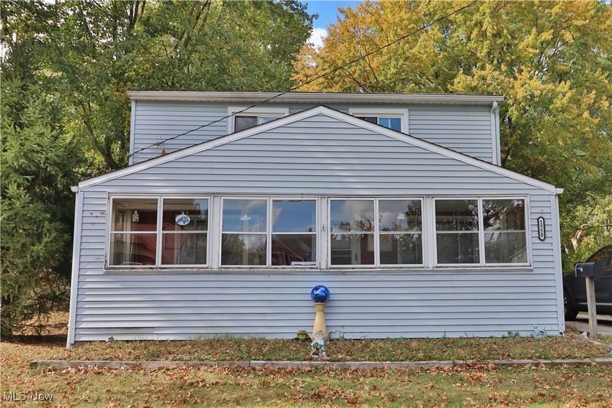 This Eastlake property at 1550 E 337th is a renovator's dream, offering a rare combination of one acre of private, wooded land and core system updates. This is a bold chance to build immediate equity.

The home is a genuine BLANK CANVAS. While the cosmetics require a total overhaul, the interior offers generous square footage ready for your custom design, allowing you to maximize the potential of every room. Key areas for transformation include a Large Kitchen Footprint with a charming built-in hutch, a convenient First-Floor Master Bedroom with an oversized bathroom awaiting a spa-like remodel, and flexible living spaces. The spacious enclosed front porch adds valuable square footage, ready to be insulated and finished into a bright, year-round sunroom or mudroom.

Crucially, the major infrastructure is already addressed: the home features Upgraded Electrical and Plumbing Systems and a Newer Furnace. The expensive, vital mechanics are sound, leaving you free to focus your budget and creative energy on the exciting interior finishes. A generous laundry room further enhances the functional aspects of the main floor layout.

The value is magnified by the exterior. The Massive Wooded Yard is sprawling, private, and beautifully treed, offering a secluded retreat rare for the area—perfect for adding a deck, pool, or firepit area. A 1-car detached garage provides storage. This is a Commuter's Dream Location, providing quick access to amenities on Vine Street and Route 91, with excellent connectivity to major highways: Routes 2, 90, and 271.

This opportunity is ideal for buyers seeking immediate equity potential and total design control over their custom estate. CASH or Conventional Rehab Financing is highly recommended due to the condition. Don't miss this chance to acquire land and create your custom estate without the new-build price tag. Schedule your private showing today!