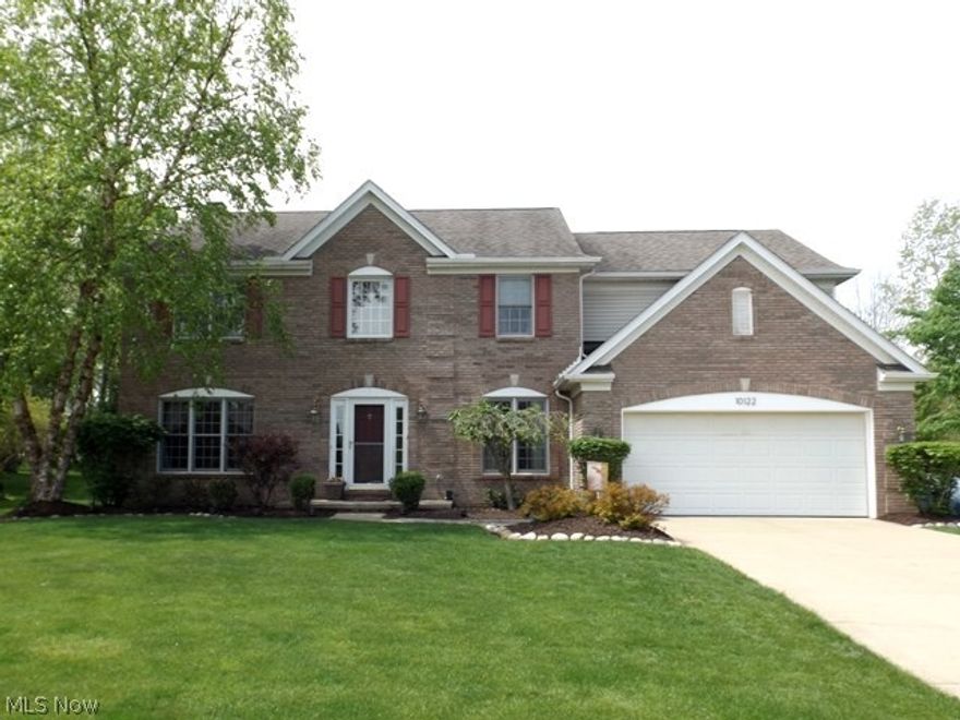 Beautiful!  Welcome to this brick front transitional situated on a pretty lot backing up to trees with a common area along side of house.   As you enter, there is a two story foyer opening to the living room/den and dining room.  The two story great room features  a wall of windows and a fireplace and is open to the spacious kitchen with an abundance of cabinets, a center island with granite, recently finished wood floors and an eating area that opens to the 12x10 screened porch and deck.  There is a first floor laundry. All bedrooms are on the second floor with the master suite having a vaulted ceiling, walk in closet and a glamour bath with double sinks, a whirlpool tub and separate shower.  All other bedrooms and full bath are generous in size.  Not to be missed is the finished lower level with a craft room, recreation room, half bath and plenty of room for storage.   There are playgrounds in the neighborhood and the location is convenient to schools, shopping and the freeway.