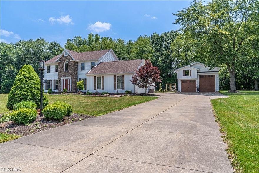 Welcome to this 4-bedroom, 3-bathroom, 2-story gem located at the end of a tranquil cul-de-sac on a generous 1.5-acre lot. As you step inside, you'll immediately notice the sleek and inviting  flooring that extends throughout the first and second floors.  Off the foyer is the remodeled dining area and cooks kitchen.  Outside the kitchen door, you'll discover an edible food forest, complete with pond and waterfall. This feature allows you to step outside and harvest fresh fruits, herbs, and flowers. Convenience and organization are key in this home, and the spacious mudroom off the laundry room provides the perfect space to keep your home tidy and clutter-free. Ascending to the second floor, you'll find the primary bedroom, a tranquil retreat that offers both comfort and luxury. The fully renovated primary bathroom is a true oasis, featuring double sinks, a lavish soaking tub for indulgent relaxation, and a custom shower with dual shower heads, enveloping you in a spa-like experience. T