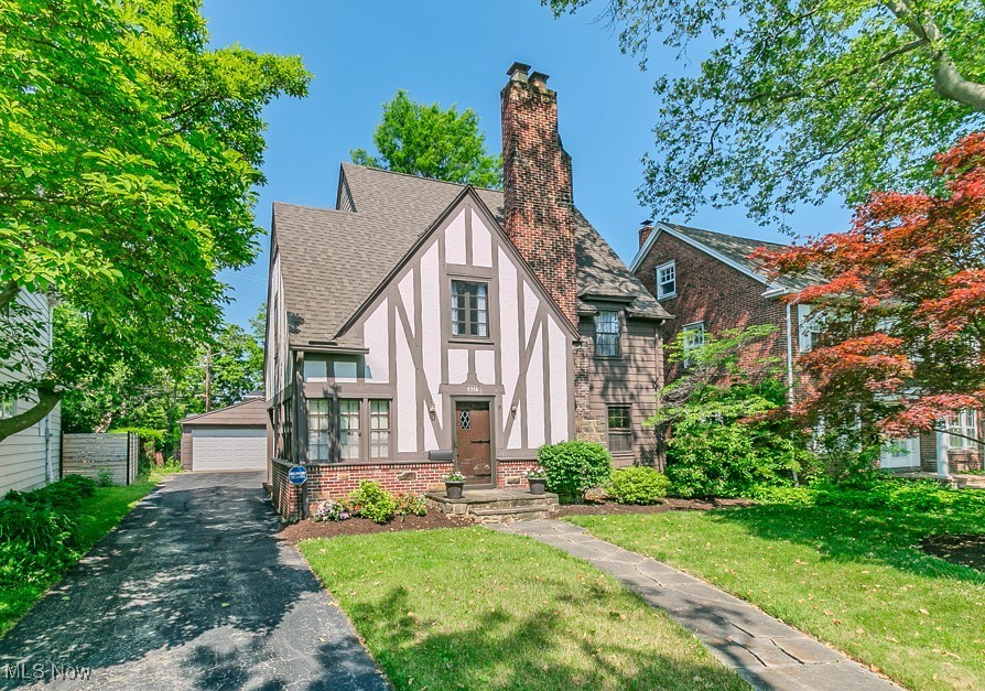 Fernway Neighborhood! * Nestled on a tree-lined street, this beautifully maintained Tudor radiates classic charm and timeless appeal. This home has been lovingly cared for, with thoughtful updates that preserve its character * Step inside to find a beautiful living room with gleaming hardwood floors. The living room, features a cozy fireplace and flows seamlessly into a formal dining room with corner cupboard & French doors * The kitchen boasts modern conveniences while maintaining the home's traditional warmth with a comfy eat-in-area and convenient pantry. All the kitchen appliances are newer and remain with the home * Completing the first floor is a cute half bath, foyer with coat closet and a beautiful sunroom with a wall of windows, French doors & built in bookshelves * Upstairs, you’ll find 3 spacious bedrooms, generous closet space including a large master walk-in closet, and a nicely updated bath, while the hall features several charming built-ins * third floor with an open bonus room, full bath with claw foot tub and large bedroom is ideal for a home office or teen suite * The partially finished basement provides even more additional living or recreation space * Outside, enjoy both the covered side porch and private backyard with patio—perfect for summer barbecues, gardening, or simply relaxing under the shade of mature trees * Located in the sought after Fernway School neighborhood and minutes from Shaker Square, local boutiques, restaurants, parks and the rapid transit * Transferable warranty from Ohio State Water Proofing AND the Seller is adding a 1 year Cinch Home Warranty for Buyer’s added peace of mind * Point of Sale Compliant! * Finished attic space not included in square footage * Whether you’re a first-time buyer or looking to settle into a home with character and comfort, this is a true gem. Schedule your showing today and experience the pride of ownership that makes this house feel like home!