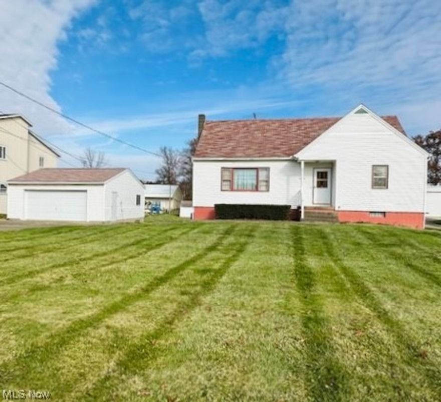 Clean, well kept bungalow on over an acre just minutes from downtown Wooster! This charming, solidly built home offers original hardwood floors, 1950s charm, and many retro details. The main floor features an entry way with large closet, L-shaped living/dining area, eat-in kitchen with built-ins, master bedroom with dual closets, second bedroom or office, and full bath. Upstairs you’ll find a third bedroom, a huge bonus room or 4th bedroom, and a half bath. The walkout basement has a summer kitchen and full bath, plus potential for more finished space. You’ll love the huge, partially wooded back yard! Listing agent is related to seller.