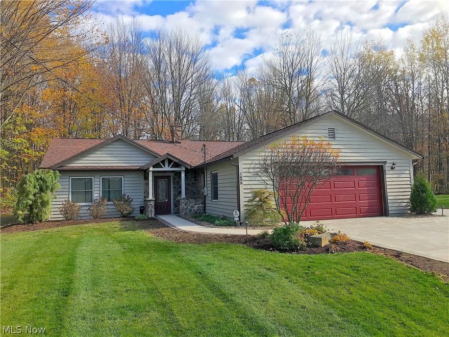 Amazing Ranch home on a double lot in the private lake community of Roaming Shores. You will know you are home from the second you pull into the brand new extra large driveway. With two beautifully landscaped lots there is plenty of yard for your children or grandchildren to play, dogs to run, or entertaining your guests on the amazing stone patio with custom outdoor fireplace. With no neighboring houses touching either side of the property and some lake views across the street, this is a rare find. Inside, you will find a spacious kitchen with lots of storage, wood burning stove, and large living room. The Master suite here features a large master bedroom, recessed lighting, and your own private attached bathroom. Close by to this home is Beach II which features one of the heated pools, a beach that you can pull a boat or kayak to, and a roped off swimming area on the beach with a floating platform to be enjoyed during the summer by Roaming Shores members. The hill at Beach II also of