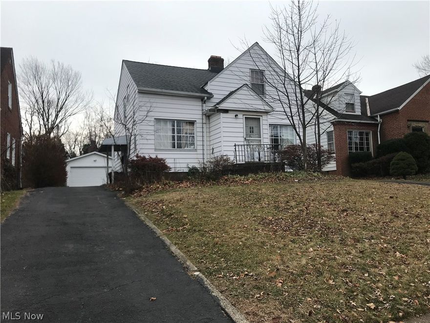 Great 4 Bedroom bungalow includes 2 full baths & partially finished basement along with newer 2 car garage.  Spacious eat kitchen with SS appliances.  Welcoming Living room with faux fireplace adjacent to dining room allows for large family gatherings.  Full bath and optional 1st floor master complete this level.  Upper level includes 3 additional bedrooms and 2nd full bath, including a 4th room for potential office.  Lower level family room, laundry area, workshop & utility storage complete this Cleveland Heights classic !  Charming bungalow built-ins throughout this comfortable home.  Updates include roof 2010, garage 2010, A/C 2006, hot water tank 2019.   Close to all amenities, & public transportation.