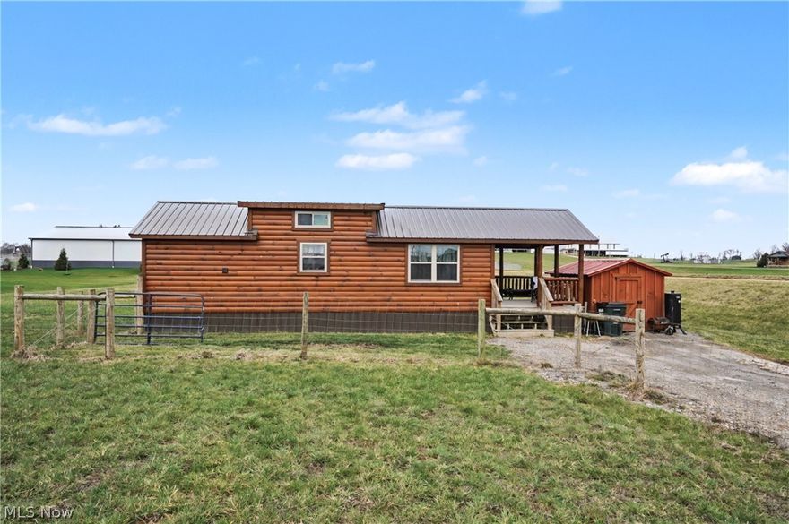 Enjoy the rare opportunity to own a charming log-sided tiny home on nearly 3 acres in Tuscarawas Township. Set
back from the road on a wide-open lot, this property offers privacy while still being conveniently located near
town amenities.
The 336 sq ft home features 1 bedroom and efficient living space, making it a great starter home, downsizing
option, or minimalist living opportunity. A covered front porch provides the perfect spot to relax and enjoy the
peaceful surroundings and open views of the property.
The acreage includes a 10x10 storage shed, 12x12 run-in shed, and a large wire-fenced area ideal for animals,
gardening, or hobby use.
With 2.91 acres of open land, there is plenty of room to expand outdoor living space,
or simply enjoy the freedom that comes with owning land while still benefiting from the low-maintenance
lifestyle of a smaller home.
A unique opportunity for affordable living with acreage in Tuscarawas Township.
Property is occupied. No trespassing. Shown by 24 hour+ notice appointment.