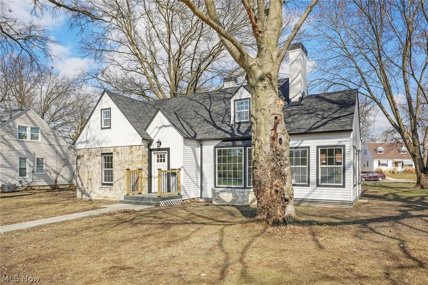 Welcome to 8612 W Moreland Rd in Parma, a completely renovated 4-bedroom, 2.5-bath home where every detail has been thoughtfully updated. The home sits on a large double lot. With a new roof, siding, windows, & furnace in late 2025, and new central air, dishwasher, disposal, concrete driveway and walkway all in 2026, this home offers both modern style and long-term peace of mind. Inside, new luxury vinyl plank flooring runs throughout, creating a clean and cohesive feel from room to room. Upon entry, you’re welcomed by a spacious living room drenched in natural sunlight from large windows, anchored by a cozy fireplace. The living area flows seamlessly into the kitchen and designated dining space, where sliding glass doors lead out to a composite deck, perfect for outdoor gatherings. The kitchen is sleek and contemporary, featuring stainless steel appliances, gold fixtures, a breakfast bar for additional seating; a layout designed for entertaining. A versatile sunroom and mudroom adds extra function to the main level. The first-floor primary bedroom is generously sized and shares a beautifully updated full bath with a second main-level bedroom. Upstairs, two additional spacious bedrooms with ample closets share another full bath. The finished basement includes a half bath, laundry area, and expansive living space perfect for recreation, a home theater, or additional entertaining. With its total rehab and thoughtful layout, this home is truly move-in ready. Schedule your private showing today!