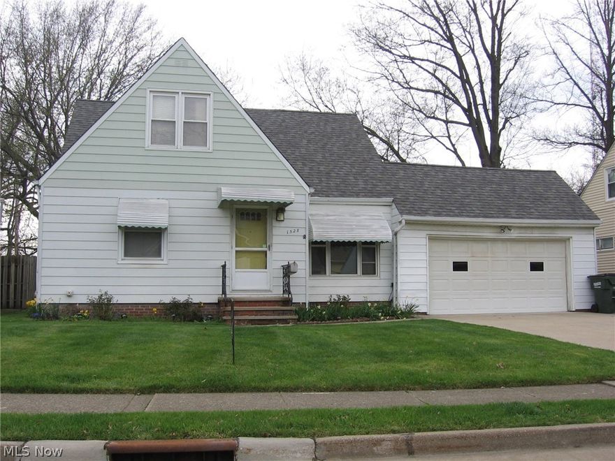 Great value is provided with this vinyl sided Wickliffe bungalow with 4 bedrooms and 1 ½ baths.  Guests enter the home through a foyer that has a closet. There is an eat-in kitchen with newer flooring, all kitchen appliances are newer and will remain.  The washer and dryer will remain as well.
Family gatherings will enjoy the holidays in the dining room that is enhanced with   corner china cabinets. Hard wood floors are throughout.  The finished basement has offers a place to relax, the electrical has been updated.  There is a covered side deck.  The two car garage has a 220 line installed.  Home is close to shopping, freeways, schools and city parks.  Check out this great home before the sold sign goes up! City POS has been completed.