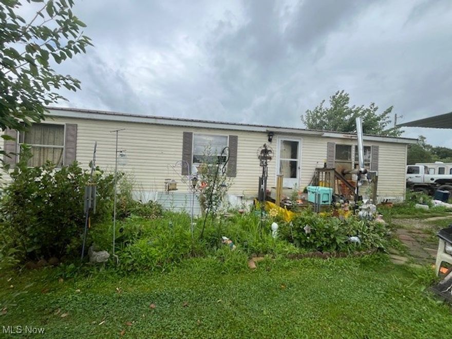 Unique opportunity for a place in the country.  Located in Richland Township, West Holmes School District.  This property has a lot offer with a 3 bedroom, 2 bath manufactured home affixed to real estate, on .866 acre.  Large outbuilding and shed. Property is currently occupied, do not approach.
