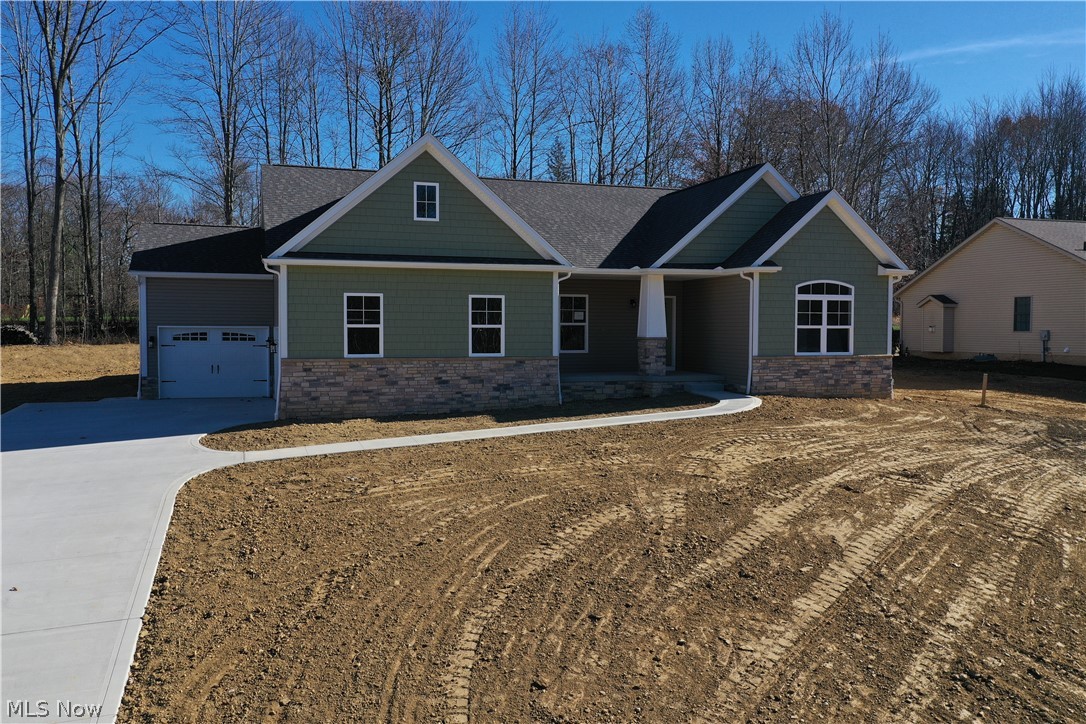 What a gem! New construction with beautiful views, a three-car garage, and a covered porch to enjoy on warm summer nights. This high-quality home has over 2,000 sq ft of bright, airy, & spacious living space. This three-bedroom ranch features a master suite with a full tile shower, a spacious walk-in closet, and tall double-sink vanities. Guest bedrooms and a private office are located in the front, away from the master suite. The great room features beautiful views with a gas fireplace to make this space cozy and warm. A large kitchen is complete with an oversized island that is wonderful for entertaining and holiday gatherings, loads of cabinetry, and stainless appliances accented by granite counters and a tile backsplash. Completing this home is a laundry room with built-in storage and a finished rec room in the basement. Quality throughout this home is nestled in a beautiful allotment with easy access to the freeway. Make an appointment for your private showing today!