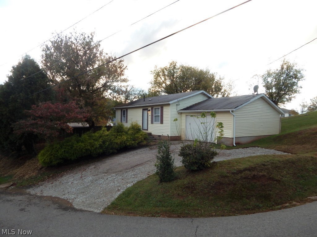 Really affordable on Reed Street! Rejuvenated 2 bedroom, 1 bath home with a one car, attached garage in town! Fresh paint throughout, new carpet, an updated bath & new garage door makes this affordable home even more appealing! If you’re just getting started, starting over or looking for an investment property to rent out, this could be just what you need! Within 2 miles to Rt 50-4 Lane so commuting is a little easier. Call for details!