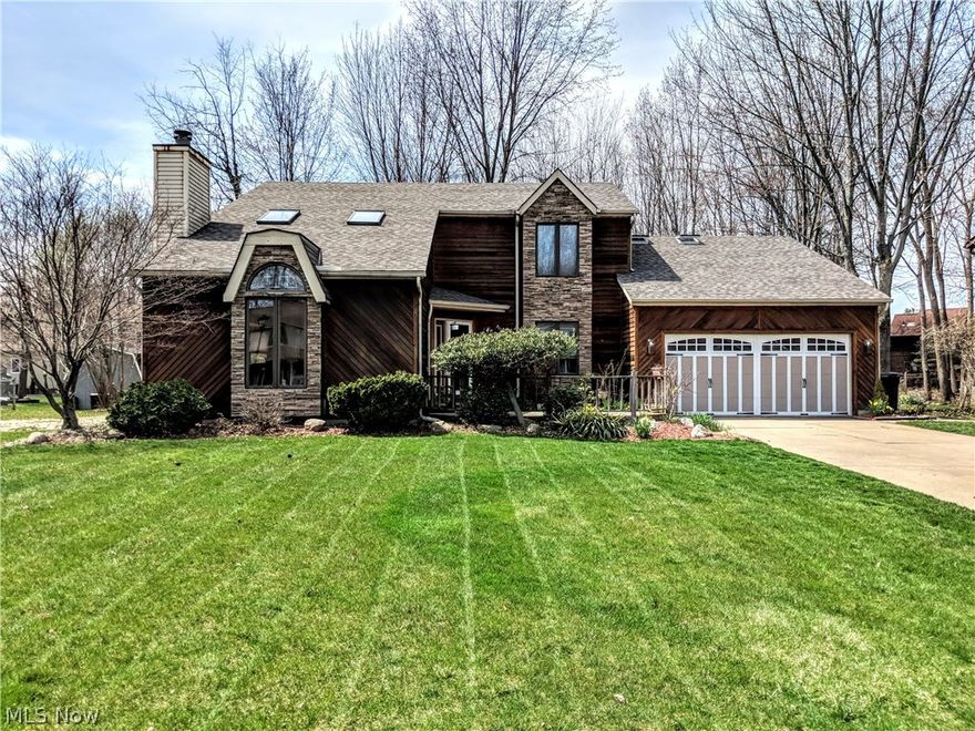 Fantastic Location!!! Spacious Colonial offers 4 bedrooms with 3 full baths and 2 half baths. 4 Car garage! this garage offers room for all your toys...also first floor bedroom with full bath great for in-law, teen or 1st floor office. Vaulted family room with fireplace, eat-in kitchen with all appliances, dining room, loft, deck, basement and more.