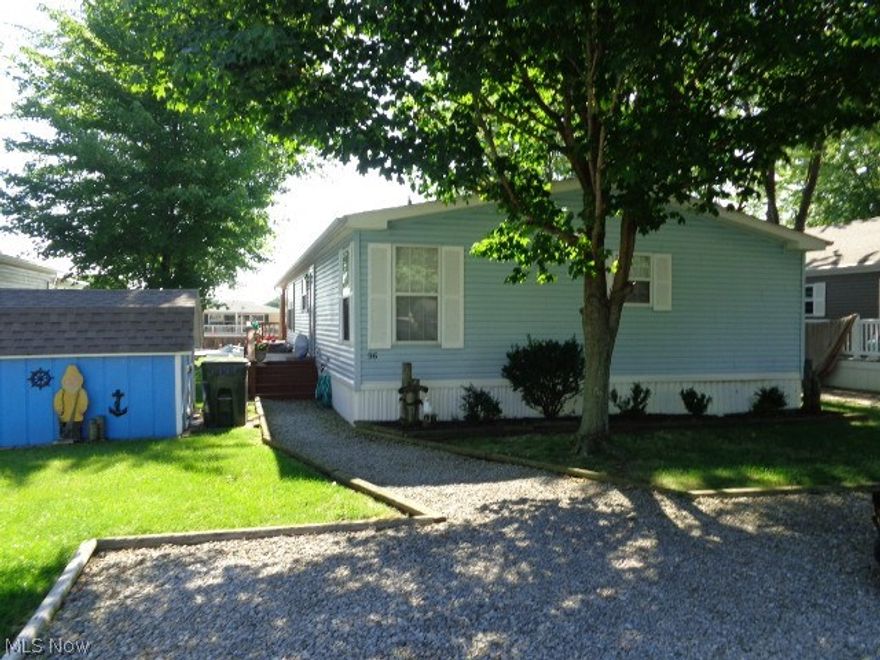 WEST HARBOR Cove with dockage at your back door!! Beautiful 3 bedroom 2 bath Modular home!! All appliances Including the washer and dryer stay!! Covered Deck overlooks the channel and dock!! Storage shed!! Association fee includes land lease,dockage,community pool,water,sewer,snow removal,and trash removal!! Year Round Park for 12 months of enjoyment!! Close to all attractions!! Easy to show!!