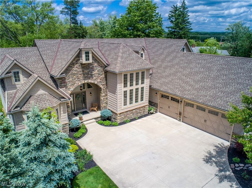 This pristine, better than new, custom built ranch will "wow" you! This one of a kind home features expansive vaulted ceilings, gourmet kitchen, exposed beams, custom interior stonework, granite and stainless appliances. Private Master Suite at one end with two large bedrooms at the other. The covered porch and custom stone patio make outdoor living like a breeze! Three car extra large heated garage will please! Full basement with extra high ceilings add an additional 2500 square feet. Just waiting to be finished as desired. Professional landscaping, updated lighting and irrigation system!