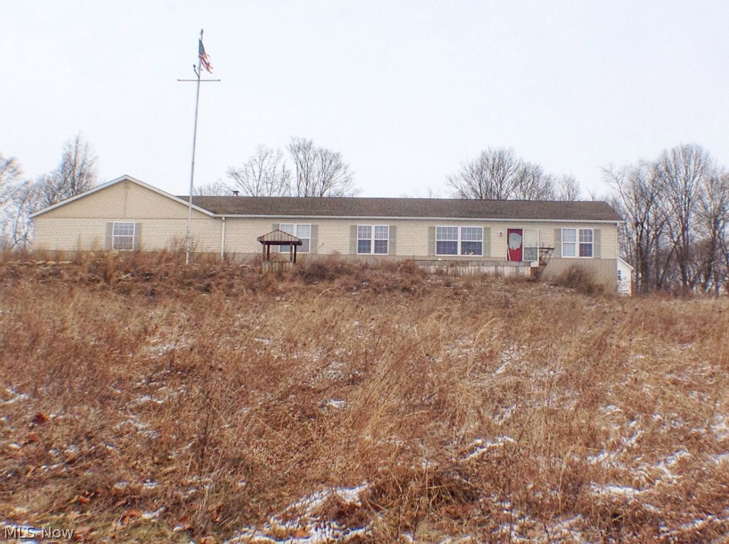 This spacious double-wide is situated on 3+ acres offers an open living concept, a large 2 car garage, 3 bedrooms, 2 bath, full walkout basement. Features include a center island in kitchen with abundant cabinets, owner suite with large bathroom. Selling "AS IS".