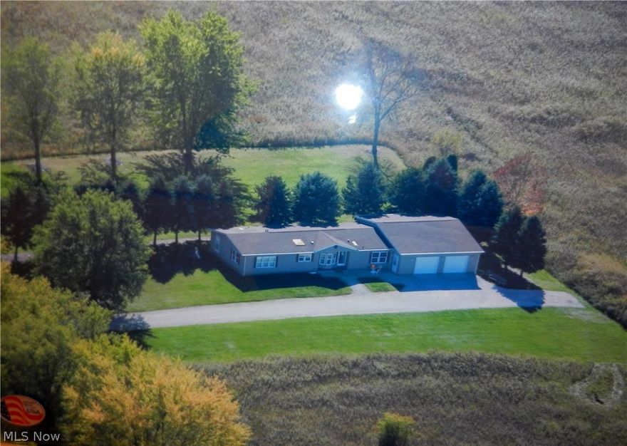 Move to the country and enjoy this lovely and serene 3 BR, 2 Bath manufactured home situated on 1 acre.  Home features a kitchen with island, family room has built-in entertainment center, master bath features 2 showers, large dining area and living room. 32 x 27 attached garage, basement with high ceilings and thick wall panel insulations.  Newer Geothermal heat, gas furnace & central air and outside backup generator.  This home has had many updates.  If you are looking for a home in the country...this one is for you.