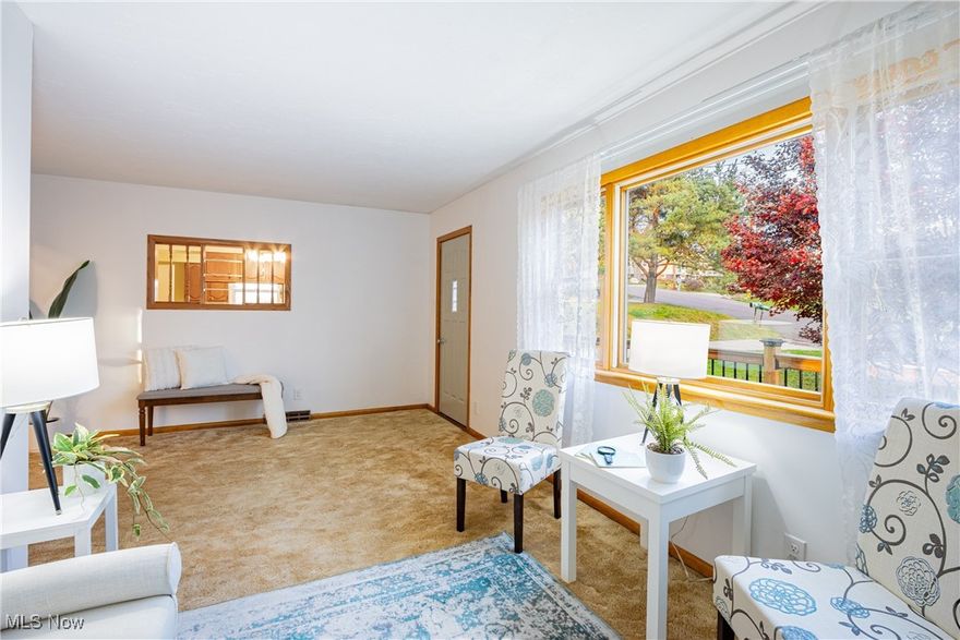 **Welcome to 1706 Woods Rd.**, a delightful and move-in ready ranch home, perfectly maintained and full of charm. This residence offers three cozy bedrooms and a spacious living room that seamlessly flows into the kitchen, enhancing the home's open and airy feel. The eat-in kitchen boasts beautiful maple cabinetry and generous counter space, ensuring both style and functionality. All kitchen appliances will remain for your convenience. The property features a lovely, expansive backyard, ideal for relaxation and outdoor activities, as well as a two-car detached garage offering ample storage. Situated on a half-acre lot at the border of Akron and Springfield, this home is ideally located just minutes from fitness centers, grocery stores, metro parks, urgent care facilities, golf courses, and more. Plus, it's only 9 miles from the Canton-Akron Airport, ensuring easy travel access. This home is truly turnkey—don’t miss out! **Schedule your showing today**