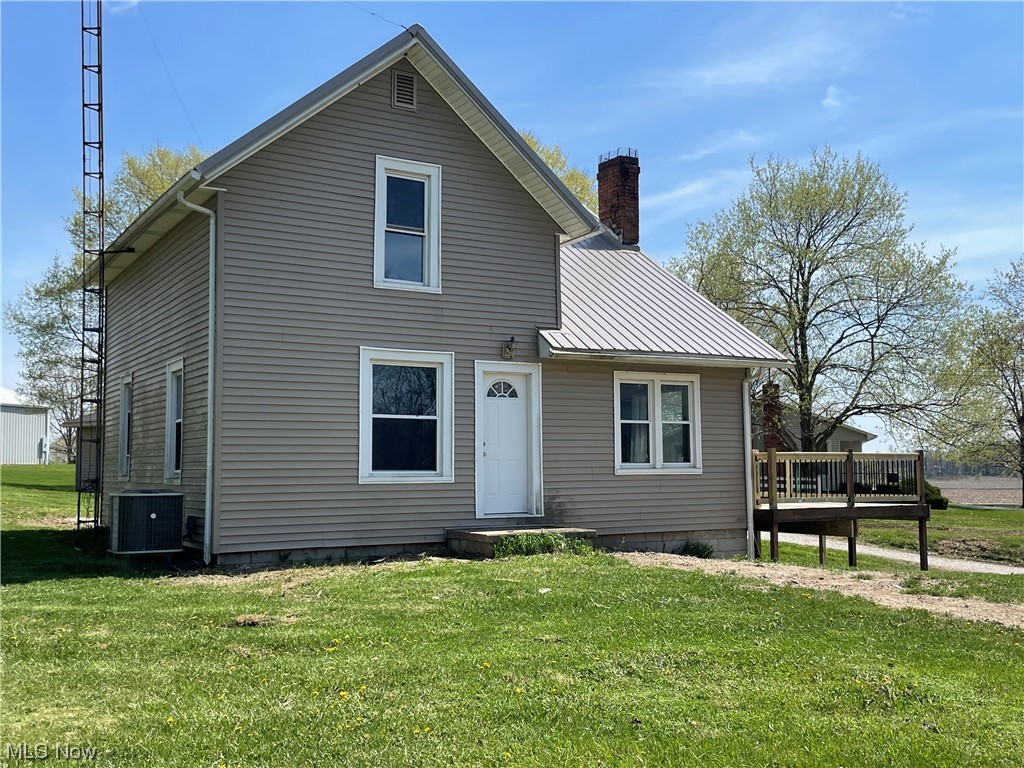 Recently renovated home with new floor coverings, light fixtures, heat pump (2022), baths/1st floor laundry room, drywall & ceilings, paint, metal roof, windows, vinyl siding, trim, ETC.