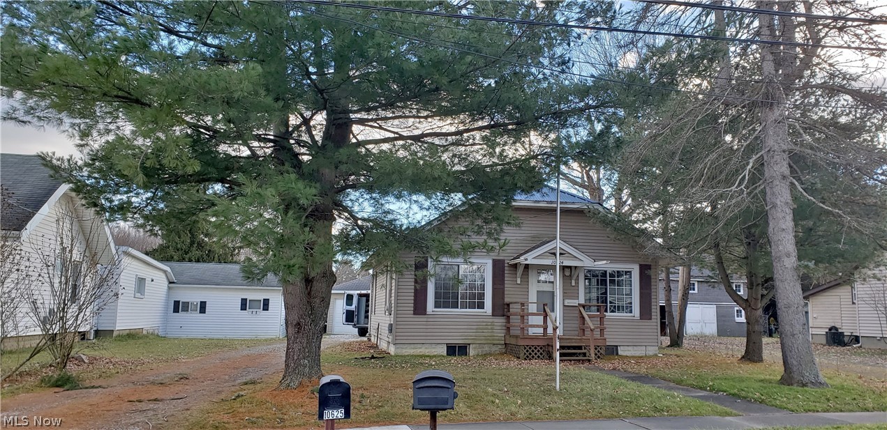 Beautiful "turn key" property newly remodeled and move-in-ready! Waterproofed basement w/transferable warranty, mold remediated. Walk-up attic for extra storage, all appliances stay. Newer electric! Metal roof and foam insulation in attic. 2-car garage, back deck and sunroom. City utilities.
