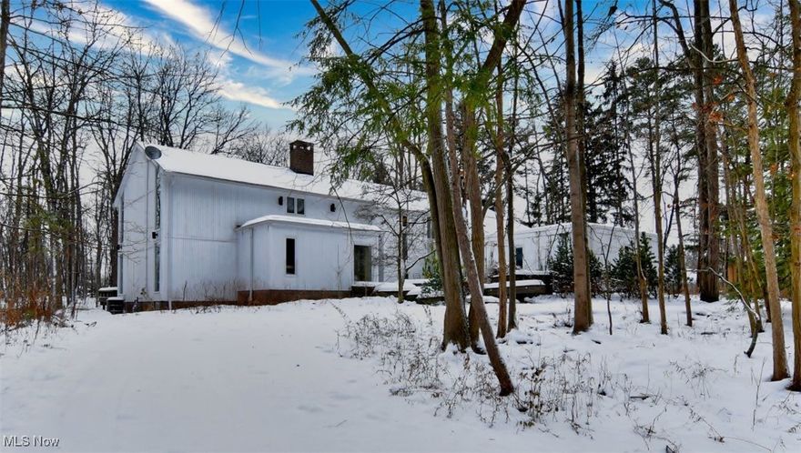 Absolutely fabulous contemporary home situated in a private wooded setting located in the heart of Beachwood on one of cities  largest lots! Rich hardwood floors. Chef's delight kitchen with high end stainless steel appliances, center island, opens to a hearth/family room with lovely fireplace and walls of glass sliding doors to deck and large lush yard. Expansive formal dining room with built-in buffet which is open to the spectacular two story great room/living room featuring soaring ceilings, walls of 'floor to ceiling' windows and a gorgeous custom fireplace wall. There is a large first floor office/media room featuring a skylight window and custom built-ins . A stunning guest powder room and oversized laundry room complete the first floor. The very Grand owner's suite has a wonderful fireplace, vaulted wood ceiling, beautiful updated spa like bathroom with a walk in shower and a free standing tub.. The owner's suite is also highlighted by the custom dressing room and large walk-in his and her closet. Upstairs has three other genorous in size bedrooms and two more full bathrooms. The sprawling and very inviting lower level has high ceilings and is perfect for a playroom, workout room, extra family room or whatever your needs may be!. Enjoy the convience of an oversized three car garage. This is a very special unique, one of a kind home! Best location!! Close to Beachwood Park with trails, Dog Park, Famous Aquatic Center, Newer Incredible playground, freeway, hospitals, restaurants, shopping. Also, not too far from University Circle and museums.